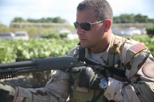 man wearing navy uniform with snipper