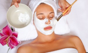 woman at spa having relaxing face mask
